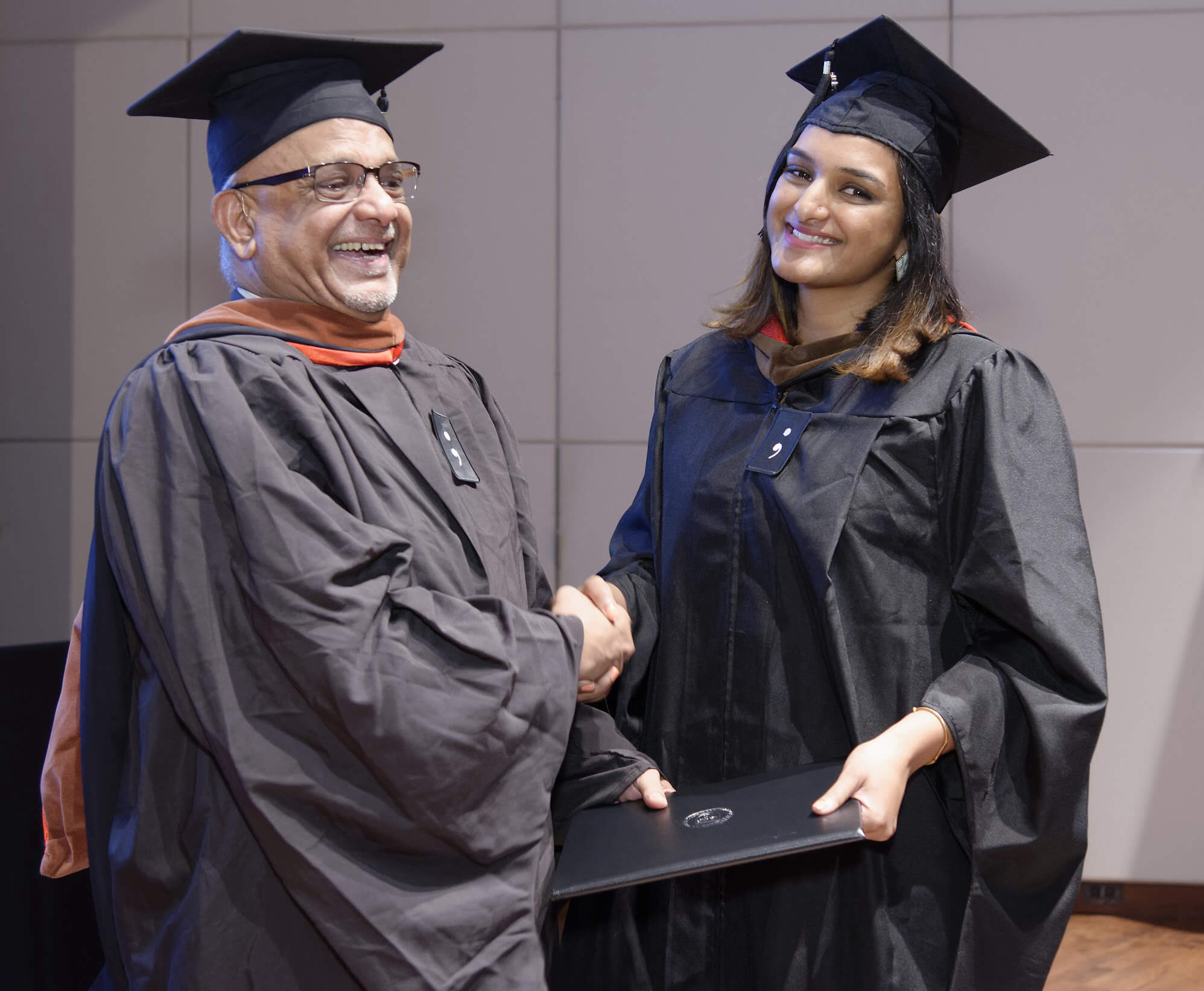 Presenting a degree to his daughter, Darshana, who graduated with an MDes degree in 2017.