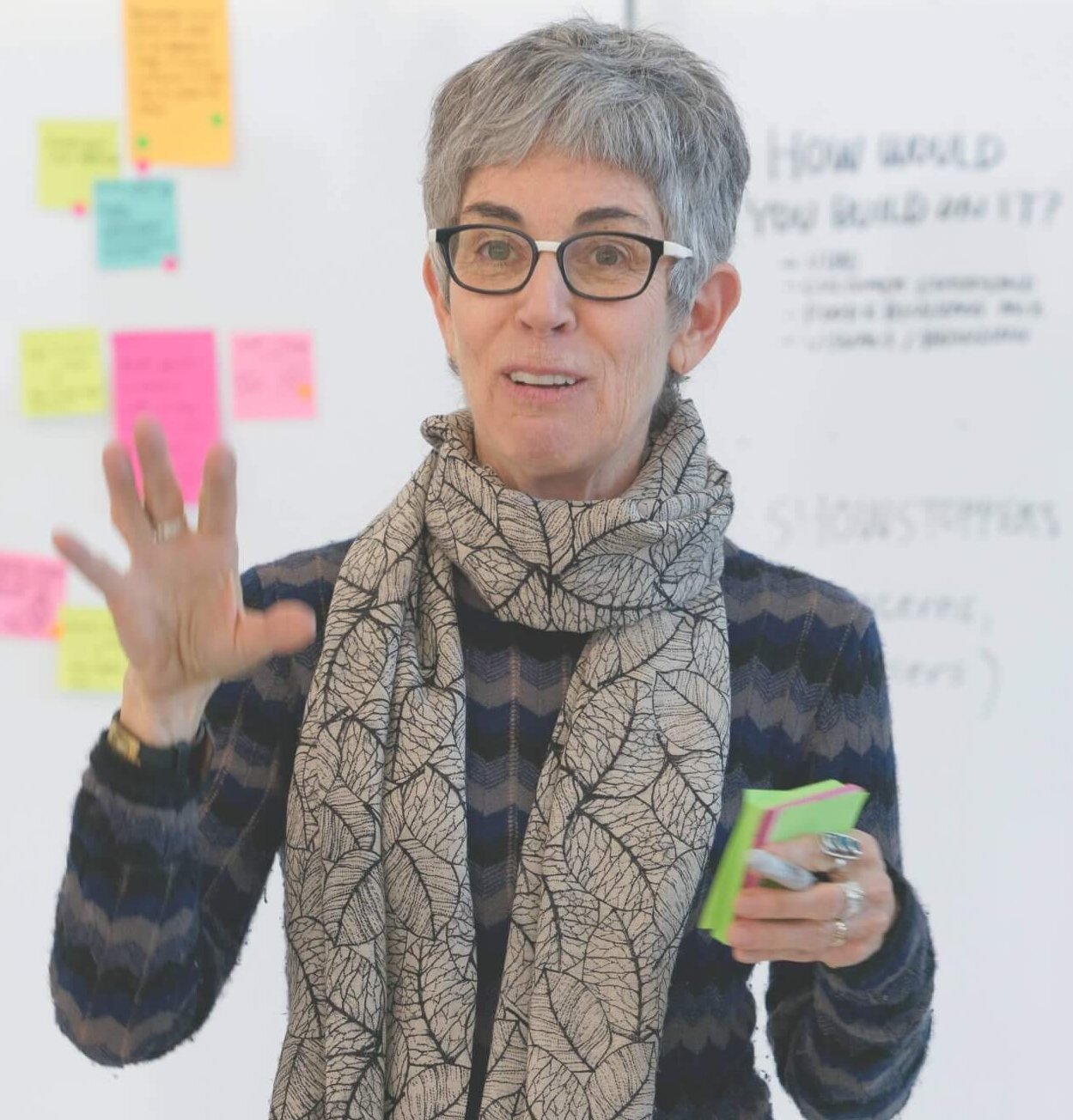 A photo of a woman running a Facilitation Methods Workshop at ID.